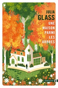Une maison parmi les arbres width=